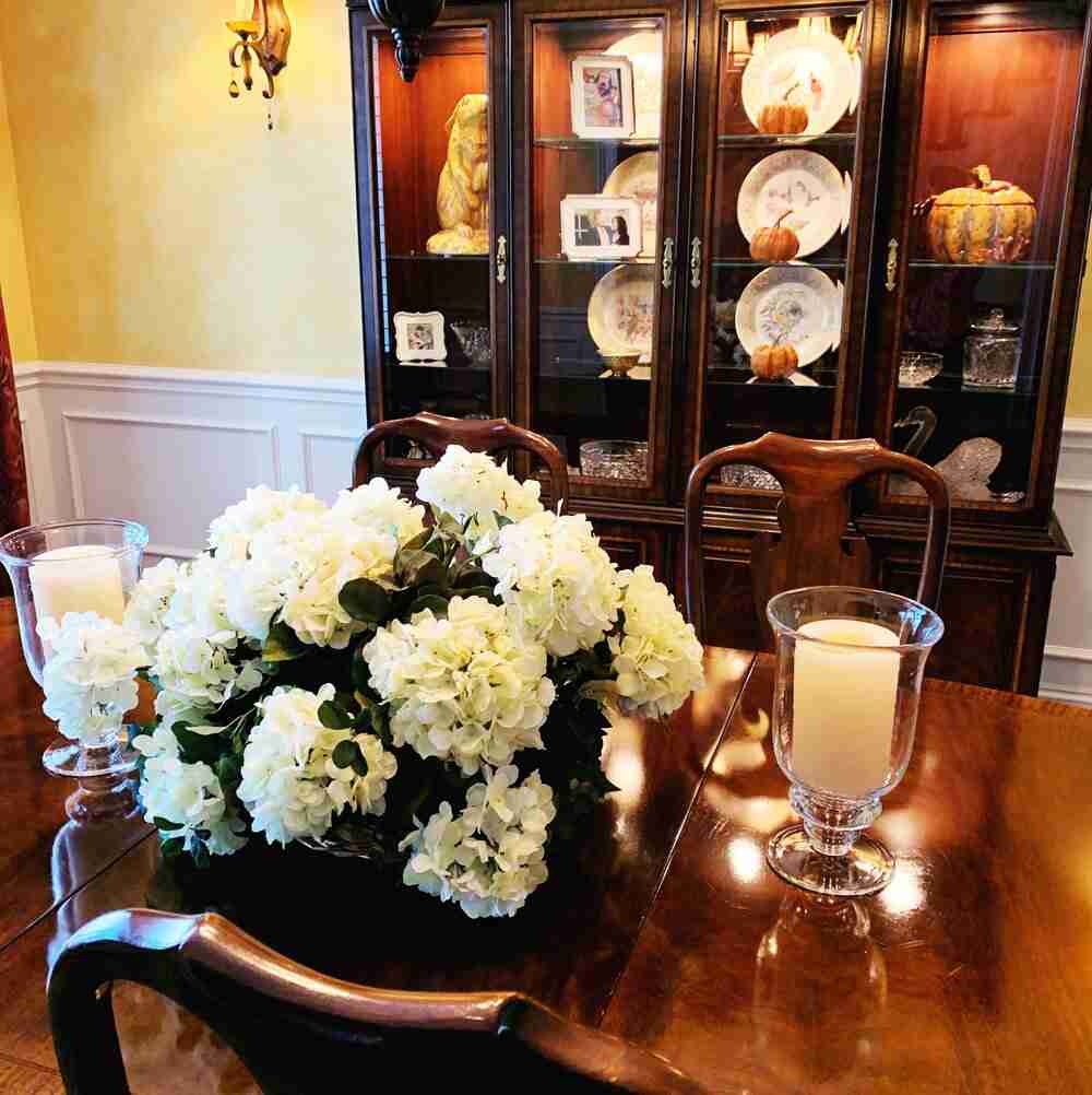 Fabulous Fall Decorations for Your Home! Sweet faux pumpkins and a ceramic pumpkin tureen are in my dining room hutch.  Silk hydrangeas are on the dining room table.