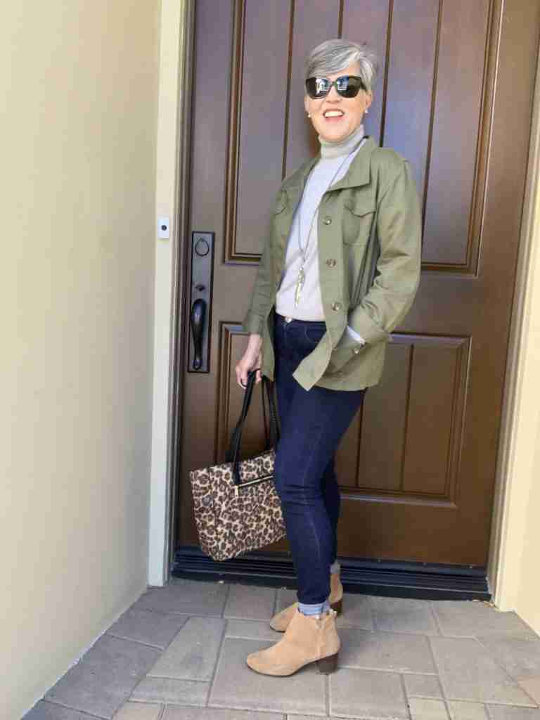 Olive green cargo jacket over a grey turtleneck with the same denim jeggings and tan booties.  I added sunglasses and a silver feather necklace.