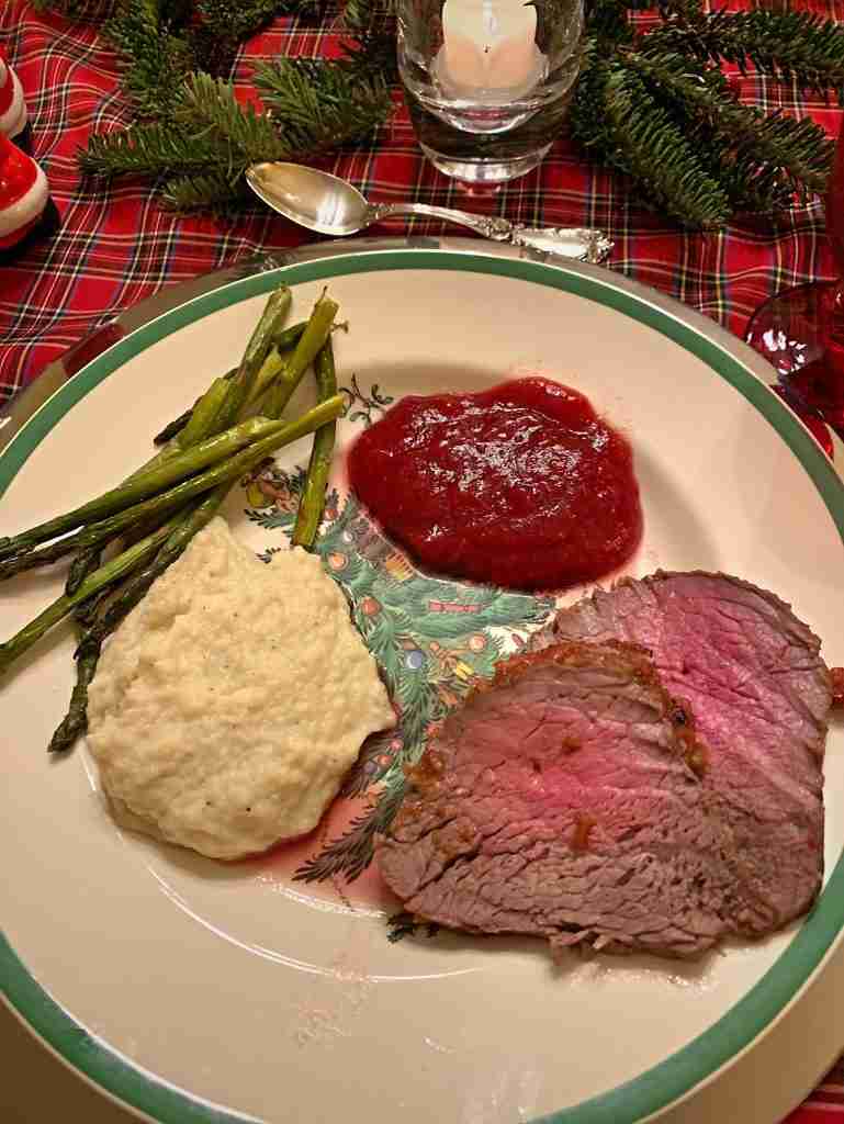 Delicious recipes for dinner over the holidays.  Here is a holiday Spode Christmas plate with yummy beef tenderloin, celery root puree, cranberry applesauce, and roasted asparagus.