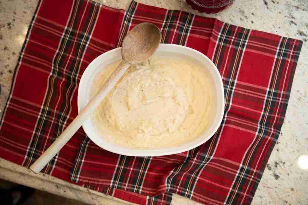 A red plaid napkin, with a big bowl of celery root puree.