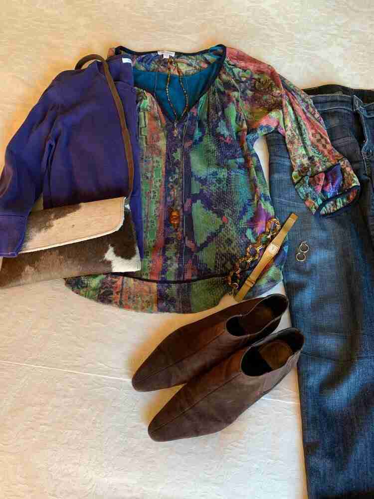 teal camisole under a blue, purple, and green sheer voile top.  Worn with boyfriend jeans. brown booties, a calfskin crossbody bag and gold accessories.