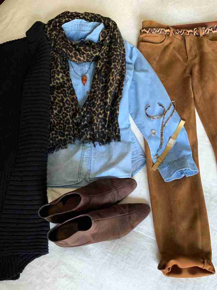 Black long cardigan over a chambray denim shirt with a leopard scarf.  Amber necklace, and gold hoop earrings and watch.  Brown booties complete the look.
