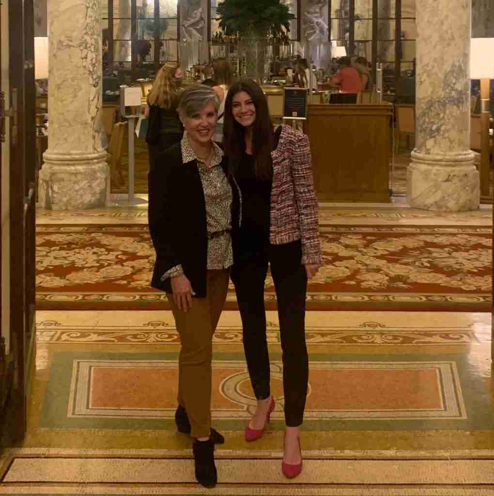 black blazer with a leopard blouse. leopard belt, brown pant, black suede bootie.  I am at the Plaza Hotel in NYC with my son's sweet wife Rachel!