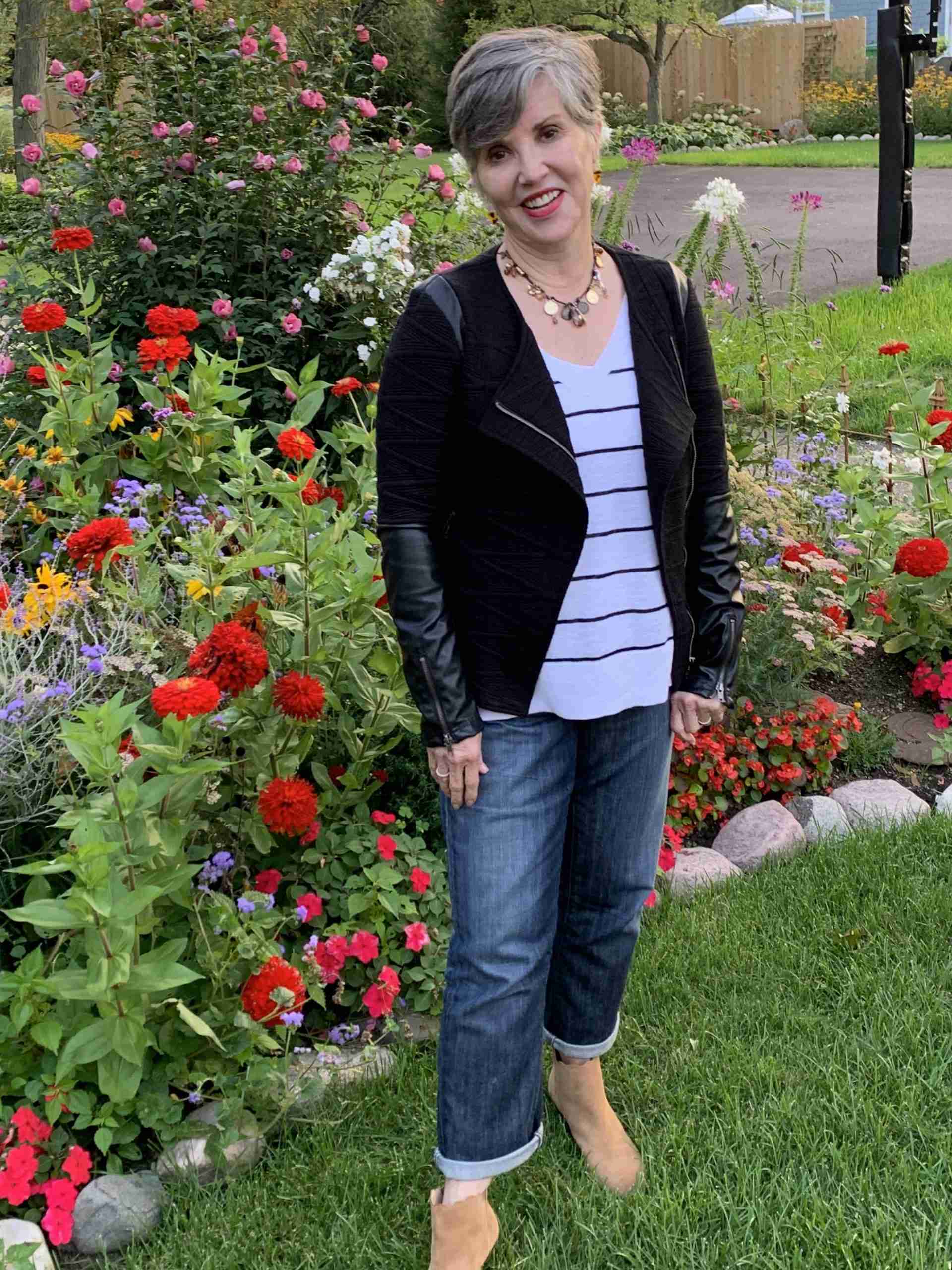 this is the fourth look to show you how to style a moto jacket.  I wore it with jeans, a white with black striped sweater and brown accented jewelry.