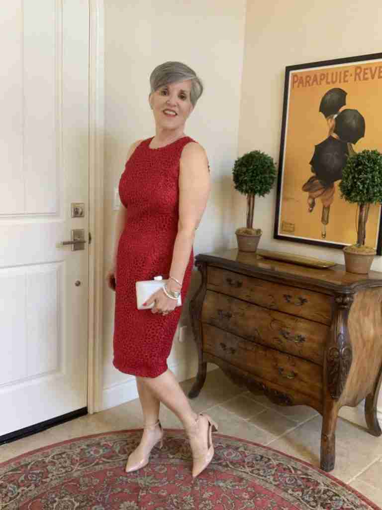 Outfit Number Four (of the Happy Valentine's Day Outfits): Dressy Red dress for Valentine's Day.  The sleeveless dressy red dress is paired with nude pumps and a white pearlized leather clutch with a rhinestone clasp.
