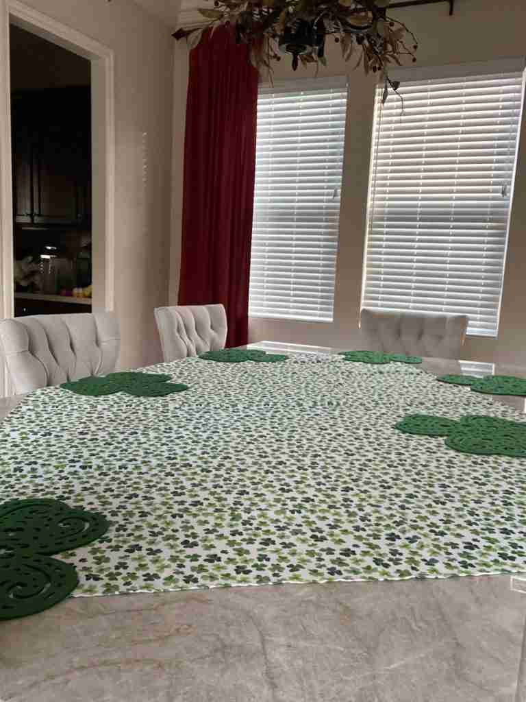 Here is a shamrock-print tablecloth with green shamrock placemats.