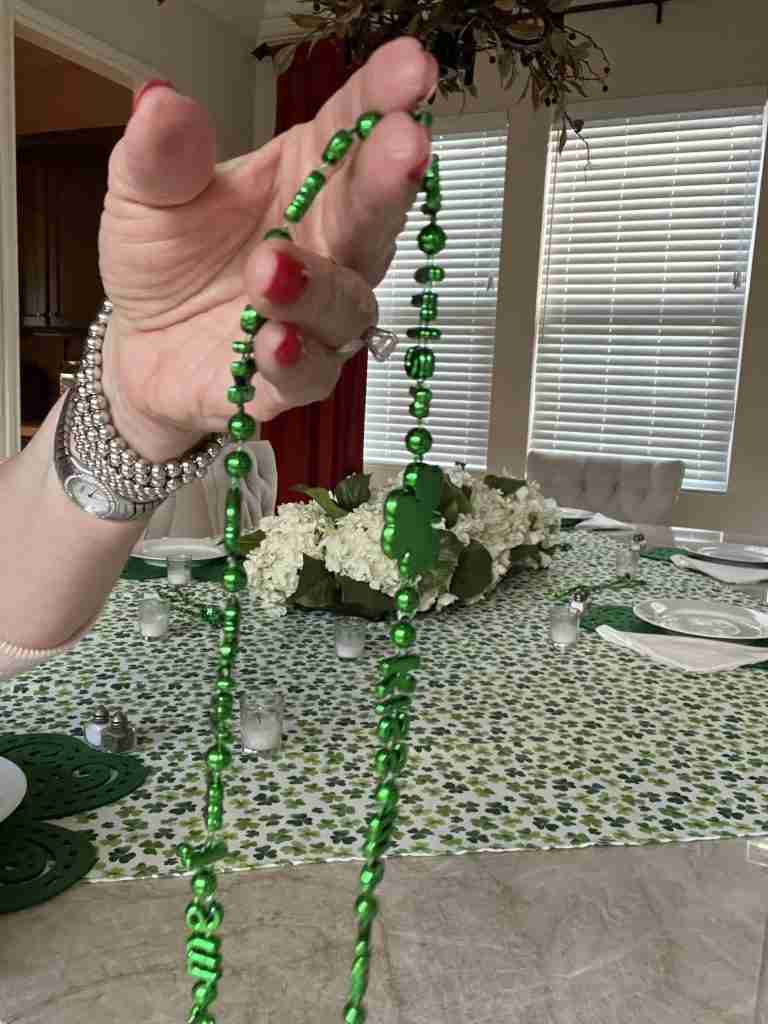 Here are green Mardi Gras beads to add to the setting.