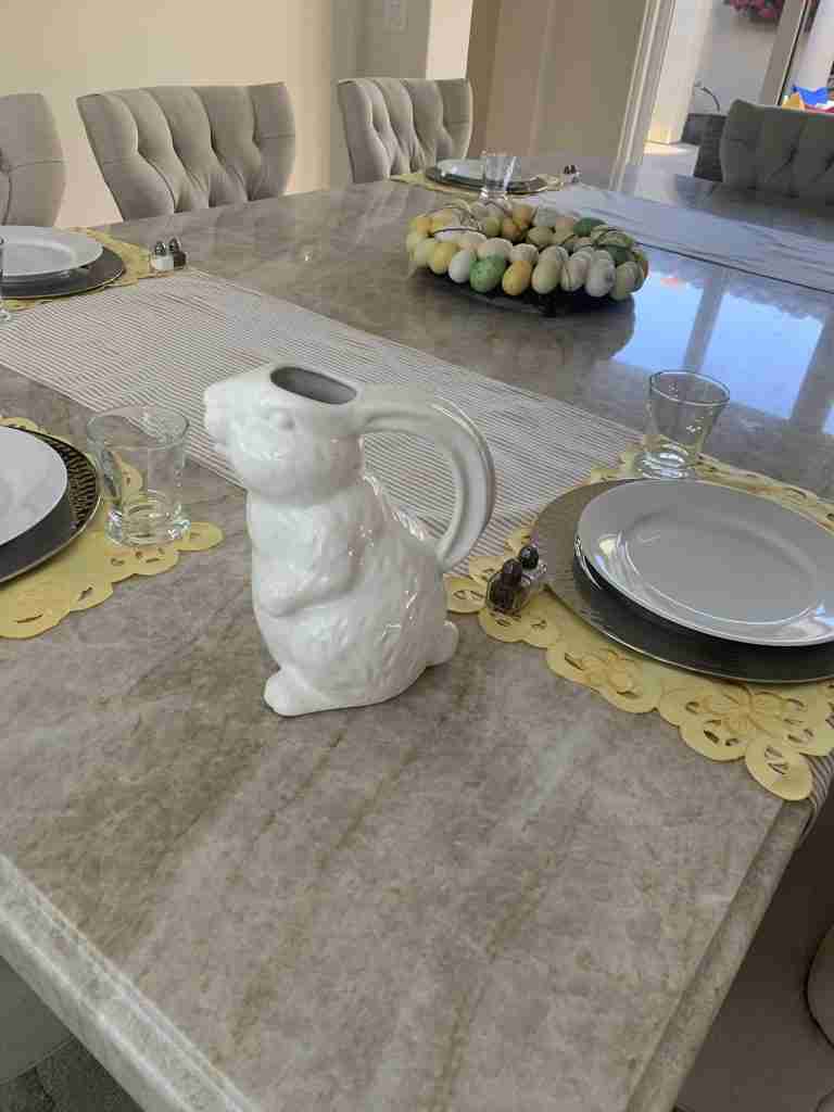 A sweet white ceramic bunny water pitcher on the Easter tablescape.
