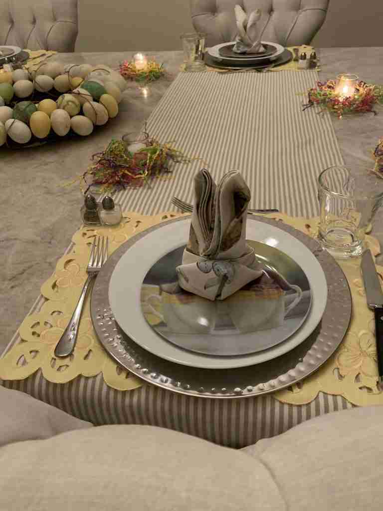 A close-up of a place setting and the wreath centerpiece.