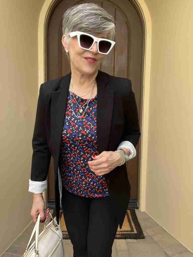 Here, I wore a dark floral tee with a black blazer and black Spanx pants.  I added the white bag from earlier looks and the silver bracelet and necklace.