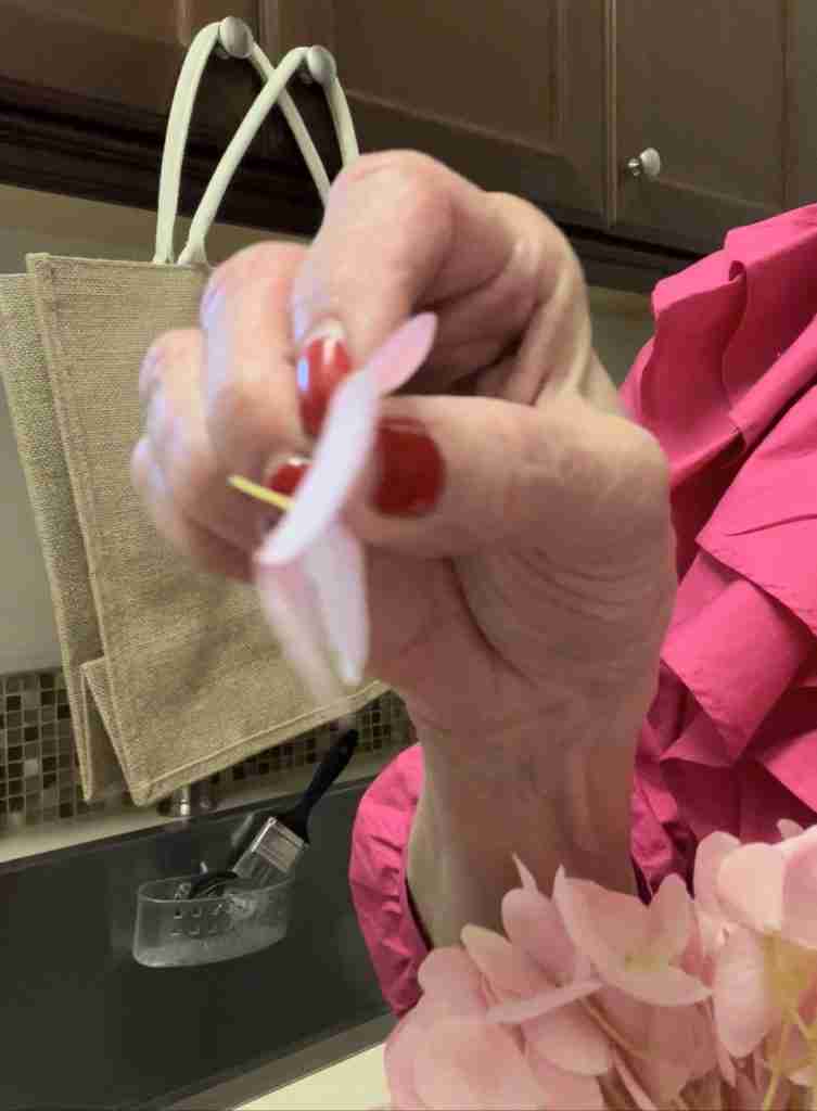 Here's me cutting up the flowers with my scissors.  here I am showing single flowers for gluing on the tote bag.