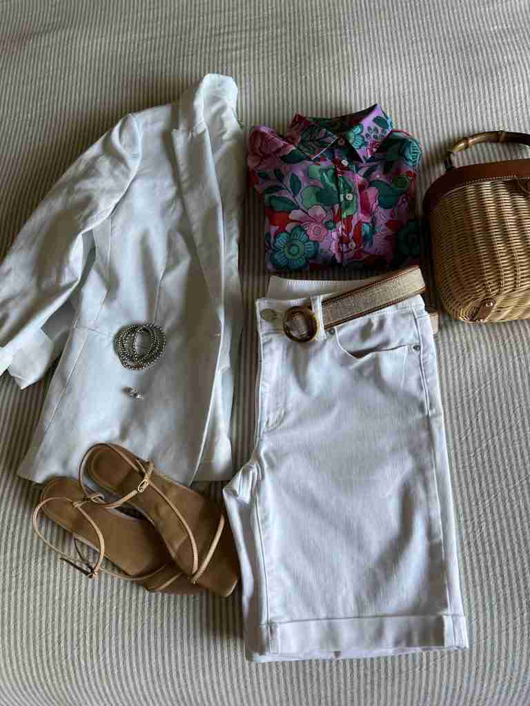 Above I have the white jacket, the white shorts, nude sandals (similar, here), and a great neutral linen and leather belt.  The wicker bag coordinates with the belt.  The beaded silver bracelets add a casual bent to the jewelry.
