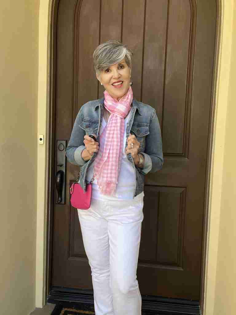 n this second outfit, I pumped the color up a bit by adding a neutral colored denim jacket with the same tank, jeans, sandals, and jewelry as outfit #1, but this time I added a bright pink cross-body bag to wear together with the softer pink and white scarf.  