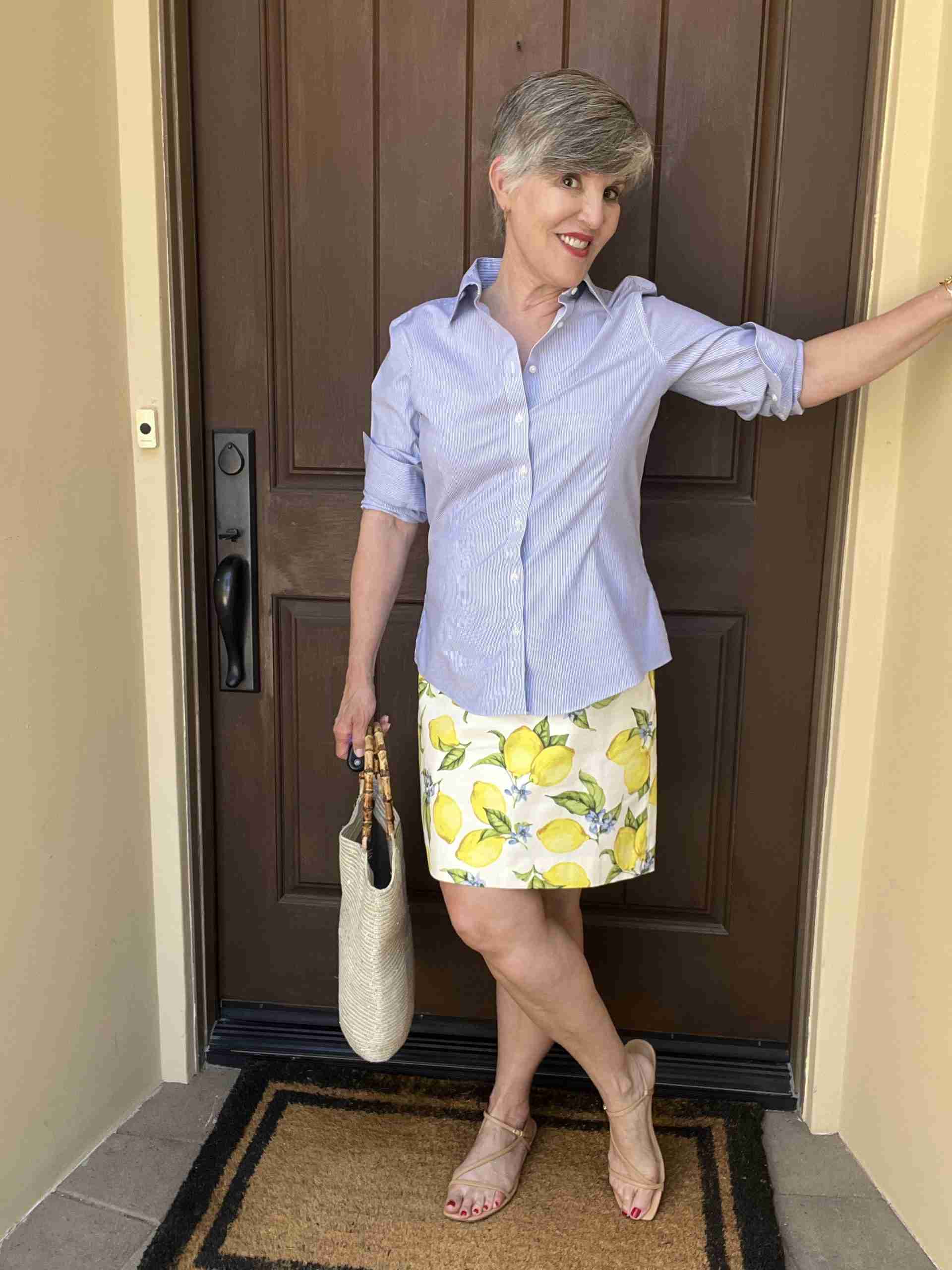 Here, I paired a lemon print skirt with a blue pinstriped shirt.  These stripes are subtle and coordinate with the blue in the skirt.  Pro-tip: A number of my readers are reluctant to wear horizontal stripes as they feel they can look wider in them.  These vertical stripes are universally flattering as they make everyone look taller and more slender.
