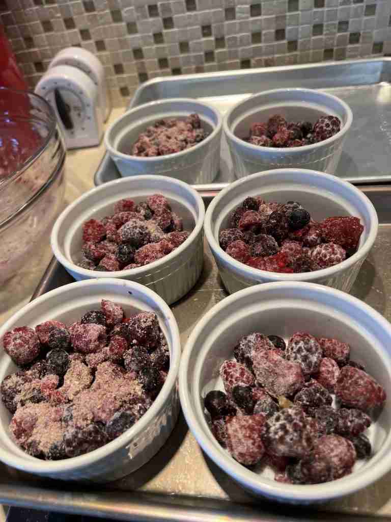 Here are the floured berries awaiting the topping mixture.