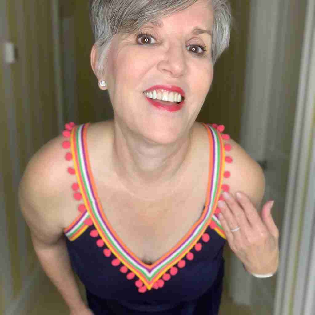 Here is a closeup of me wearing the navy blue Boden pompom summer dress.  For accessories, I am wearing diamond stud earrings.