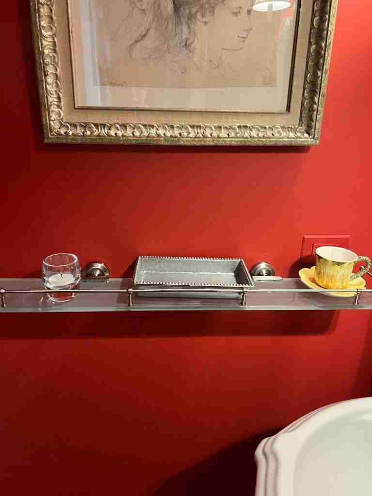 This is the powder room shelf before I decorated it for fall.