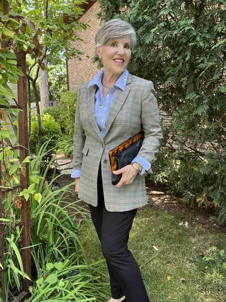 Here I put a blue cotton button-down shirt (with little doggies on it) under the glenplaid jacket.  I wore black pants, black D'orsay pumps and a black pebbled leather clutch.