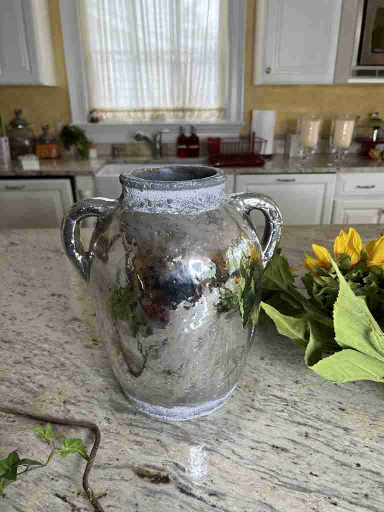 Cool silver coated pot from Pottery Barn several years ago.  The pot is heavy enough to be stable with all the tall flowers in it! 