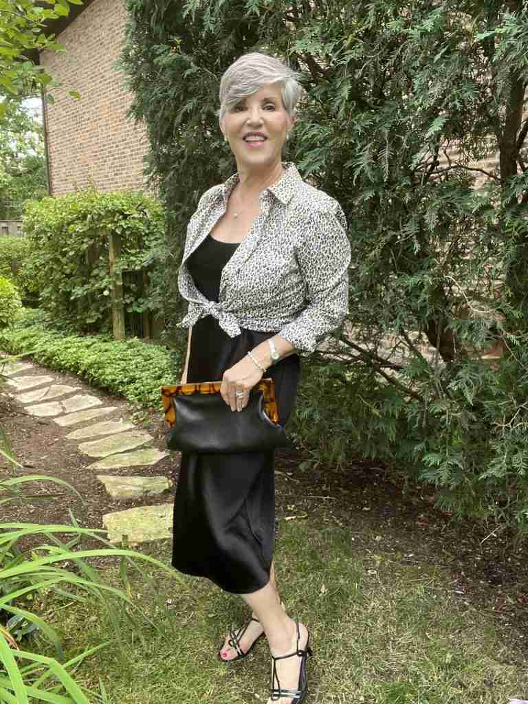 Here I am wearing a black slip dress with a leopard shirt tied over it.  My bag is black pebbled leather with a tortoiseshell clasp.