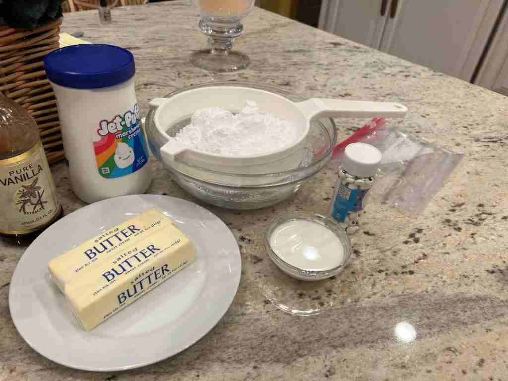 Here are the ingredients for the frosting.  I use Marshmallow fluff or creme as well as pure vanilla extract, butter, powdered sugar and milk or cream, depending on what I have in the house.