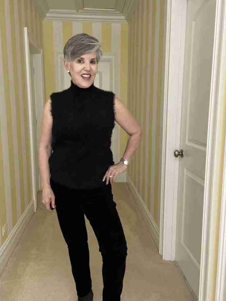 Here is the first of three casual date night outfits.  I am wearing a black fuzzy sleeveless top over black velvet jeans and grey suede booties.  My accessories are faux diamond stud earrings, a stainless-steel watch and bracelet.