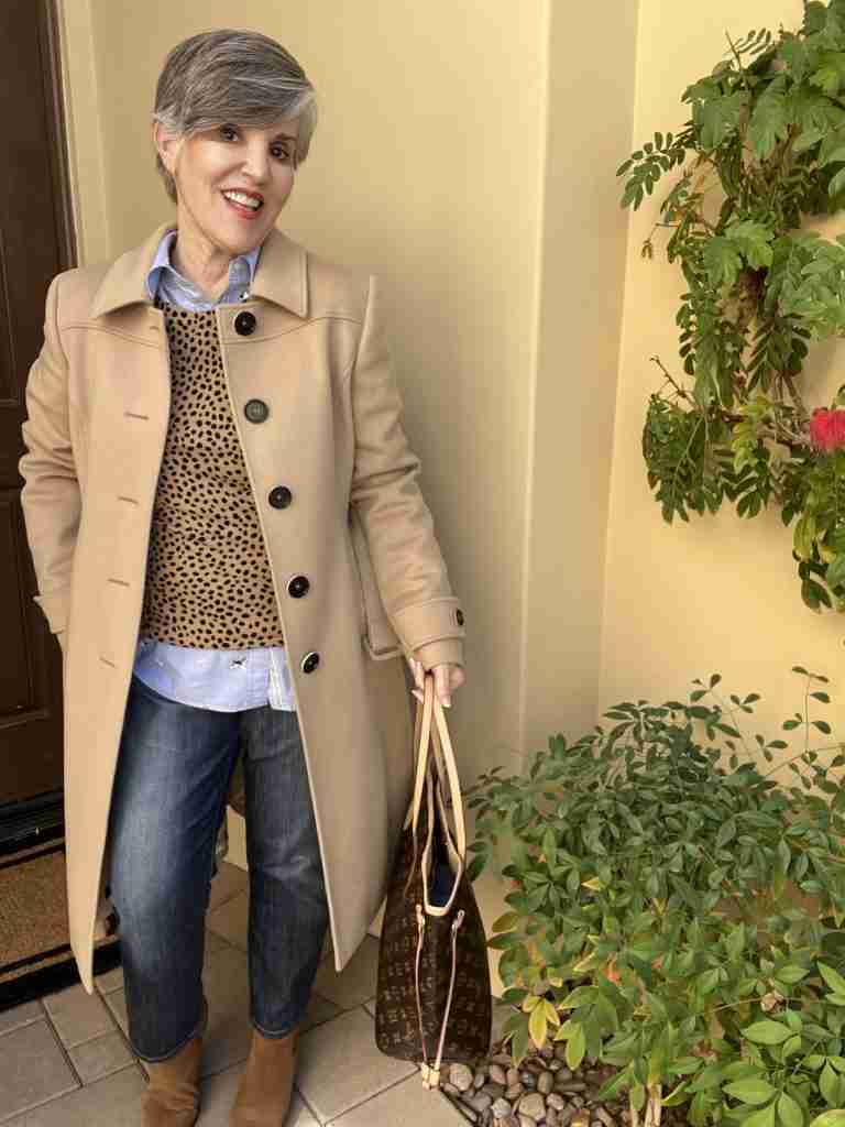 Here is an animal print top worn over a light blue shirt with cropped straight jeans and brown booties and a brown bag.  I added a tan camel's hair coat.