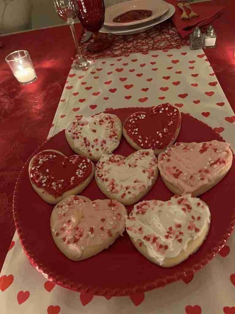 Here is a close-up of the heart-shaped cookies on a red platter,
