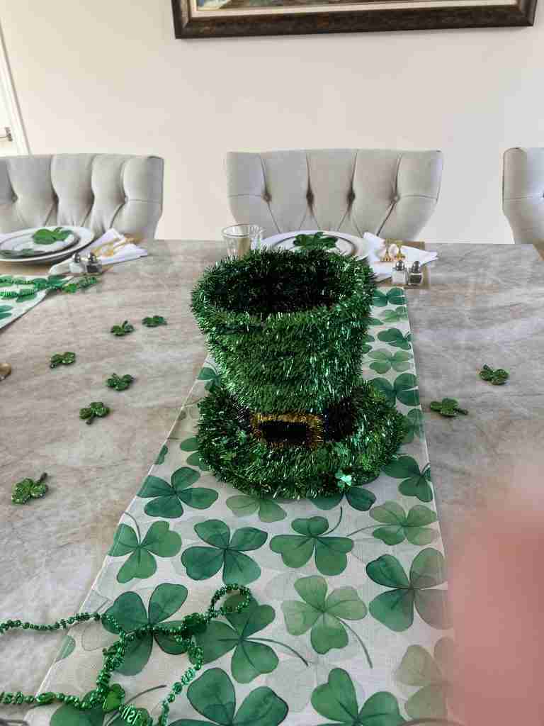 Here is the St. Patrick's Day centerpiece on the shamrock runner with sparkly shamrocks scattered over the table.