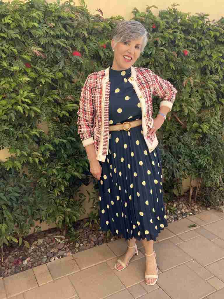 Here is the blue polka dot dress with a plaid tweed jacket.  The jacket has round gold buttons and flaps over the front pockets.
