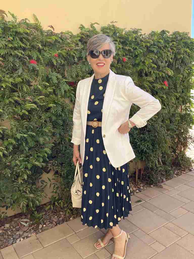 In this last outfit, I am wearing the navy polka dot dress with a white linen blazer.  I have a white Coach satchel handbag.