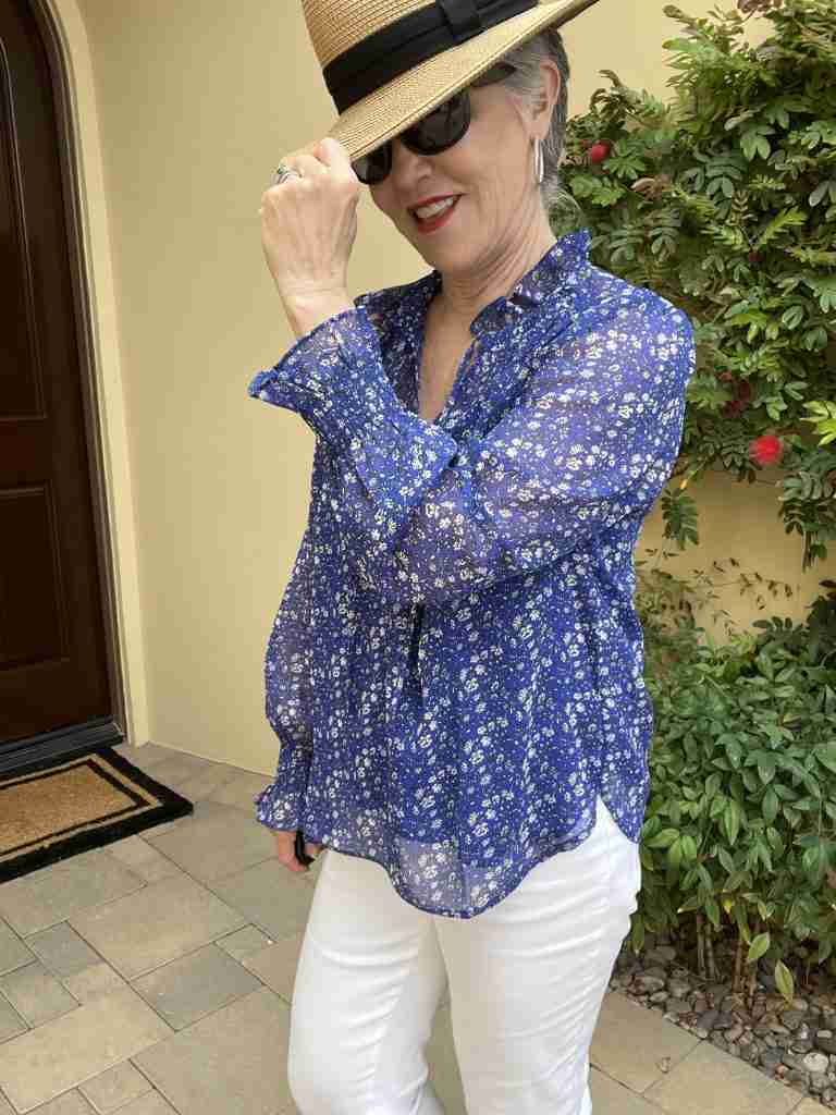 Here is the second of the spring tops for women.  It is a royal blue floral top with an attached royal blue camisole.  It is worn with a tan fedora, sunglasses and silver pave earrings.  Here is a closeup of my face, hat and the top of the top.