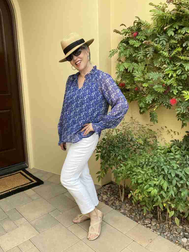 Here is the second of the spring tops for women.  It is a royal blue floral top with an attached royal blue camisole.  It is worn with a tan fedora, sunglasses and silver pave earrings.