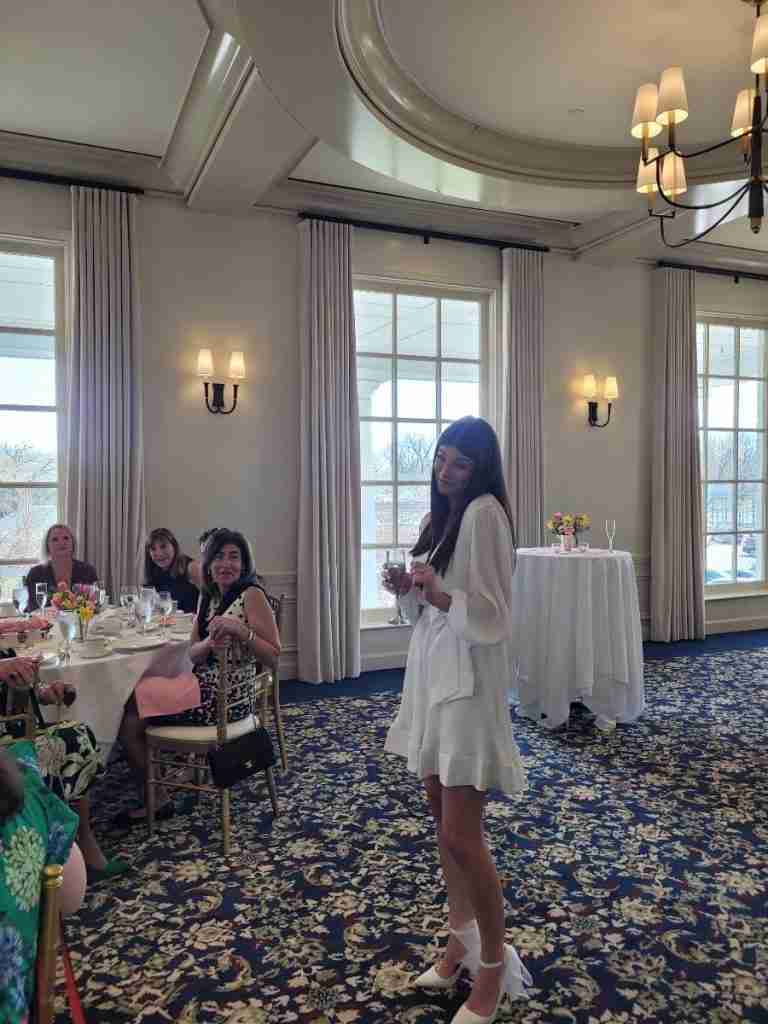 Here is my soon-to-be-daughter-in-law at her bridal shower wearing a sweet white ruffled dress and fabulous white pumps that have white chiffon bows at their backs.