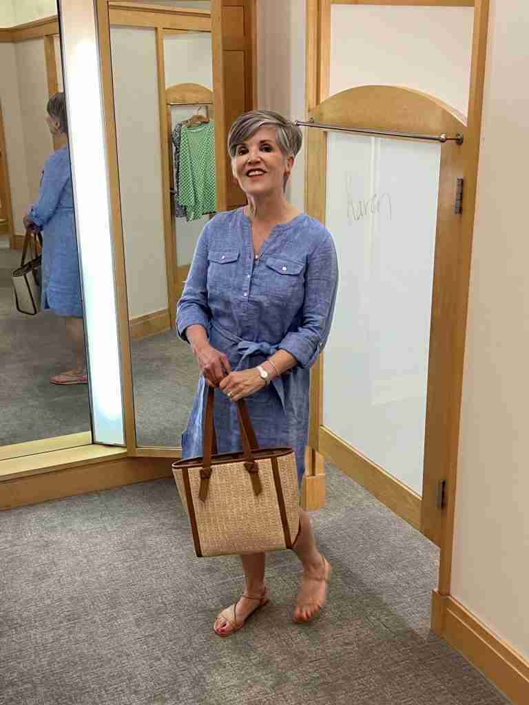 Here is a pretty 100% linen blue chambray popover dress with a self-belt.  Again I am using the natural Talbots tote and tan flat sandals.