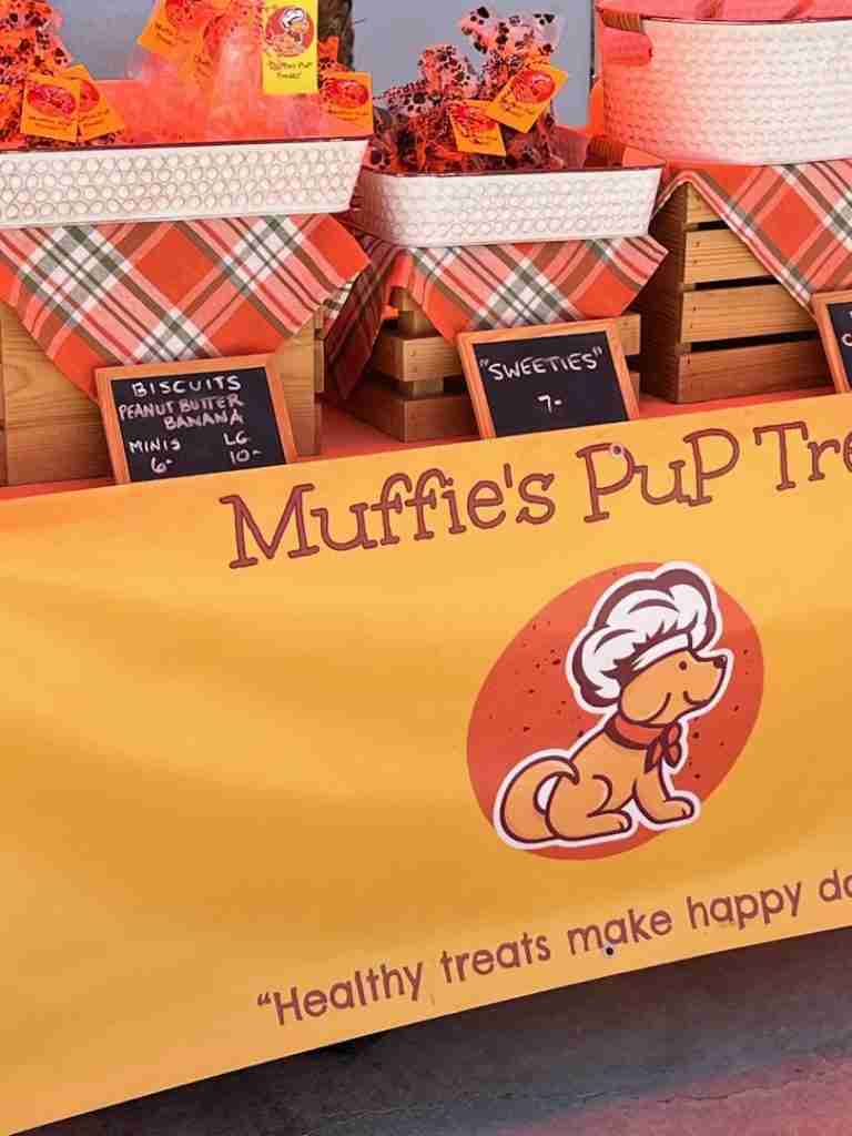 Here's a cute booth done in orange plaid with "Muffie's Pup Treats" for sale.