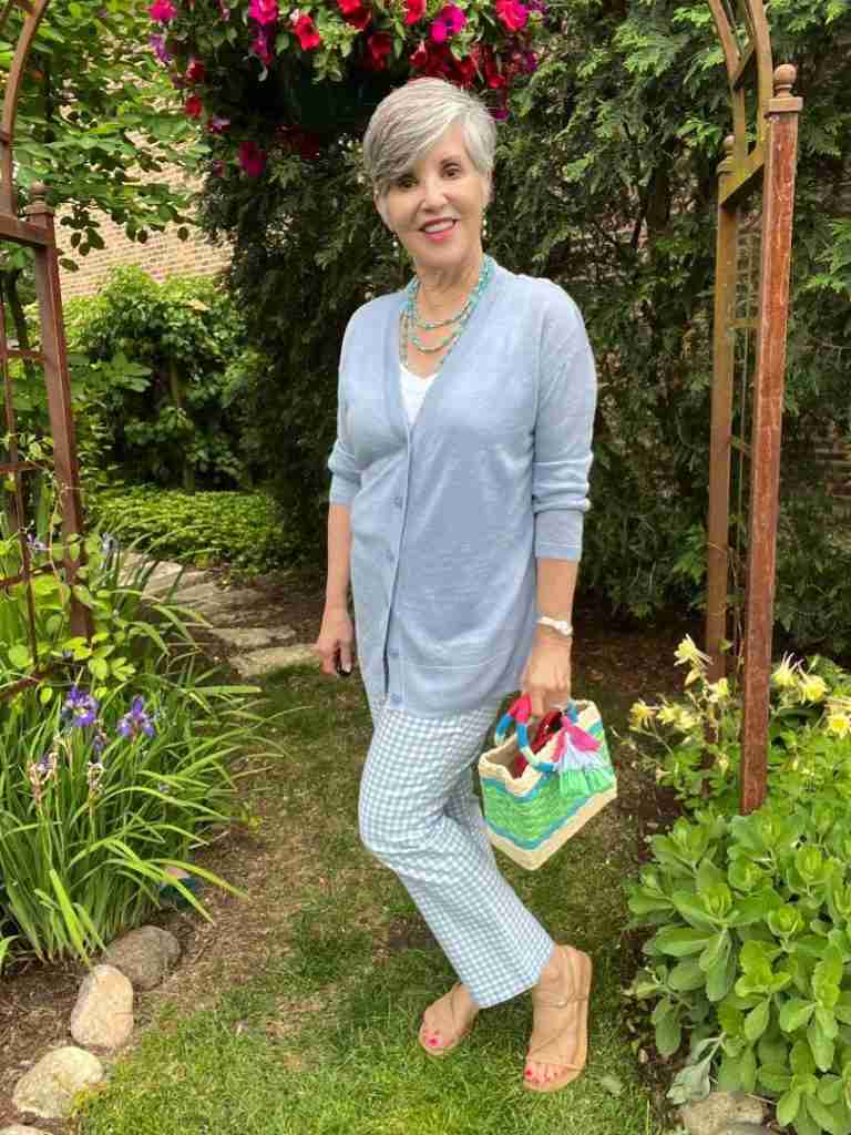 Here I am wearing a white v-neck tank with a pale blue linen cardigan over it.  I have wrapped a blue beaded necklace around my neck to fill in the neckline.  Again I am wearing my striped mini wicker bag from Talbots.