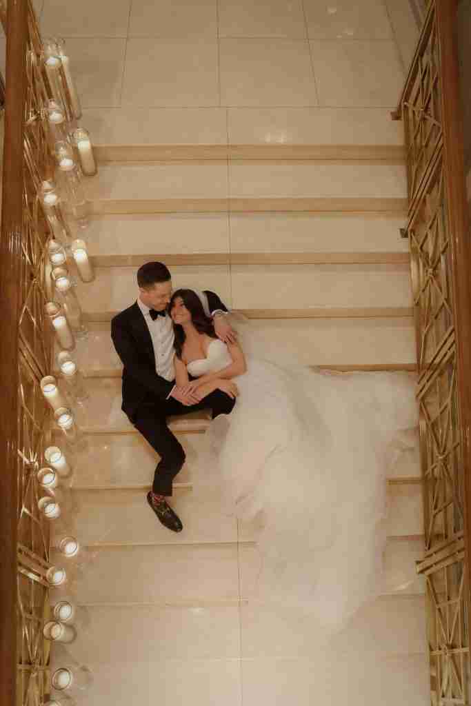 Here is the lovely couple on the stairs leading up to the reception.  There are many votive candles lit along the railing.
