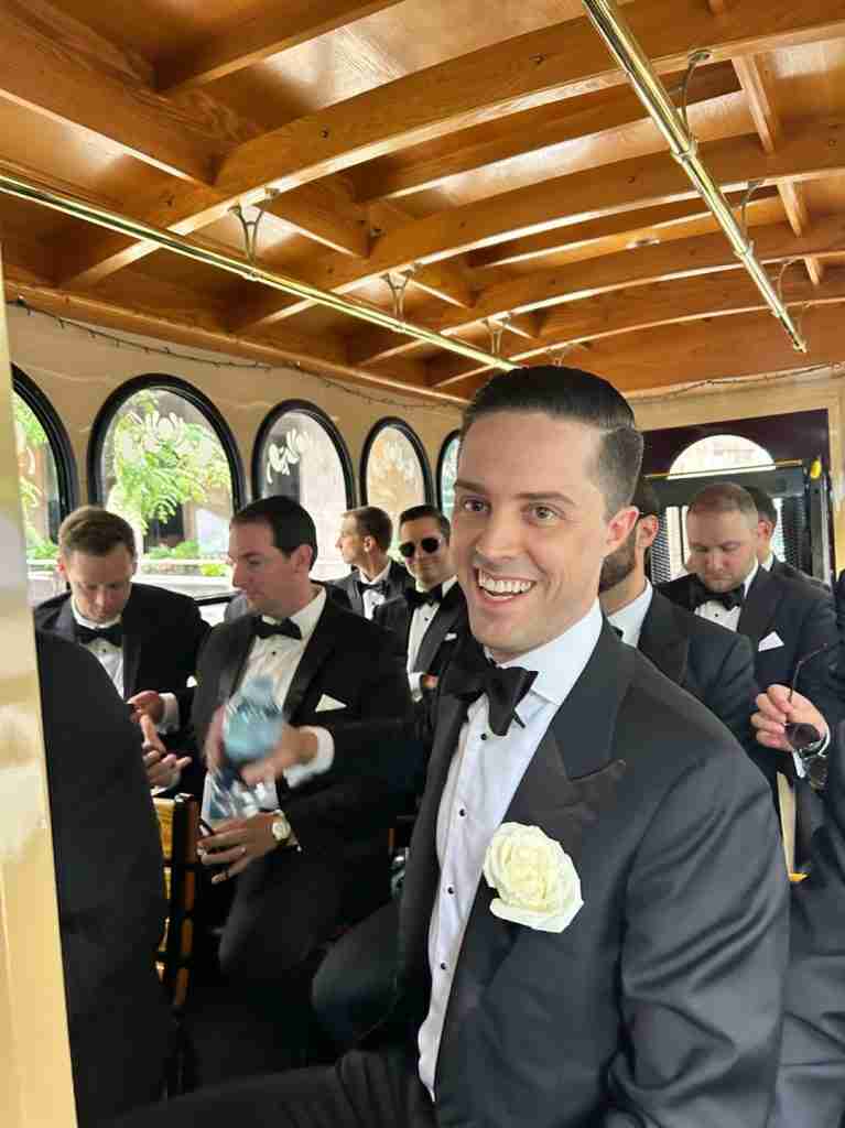 Here is the groom-to-be on his way to the church with all his groomsmen on the trolley.
