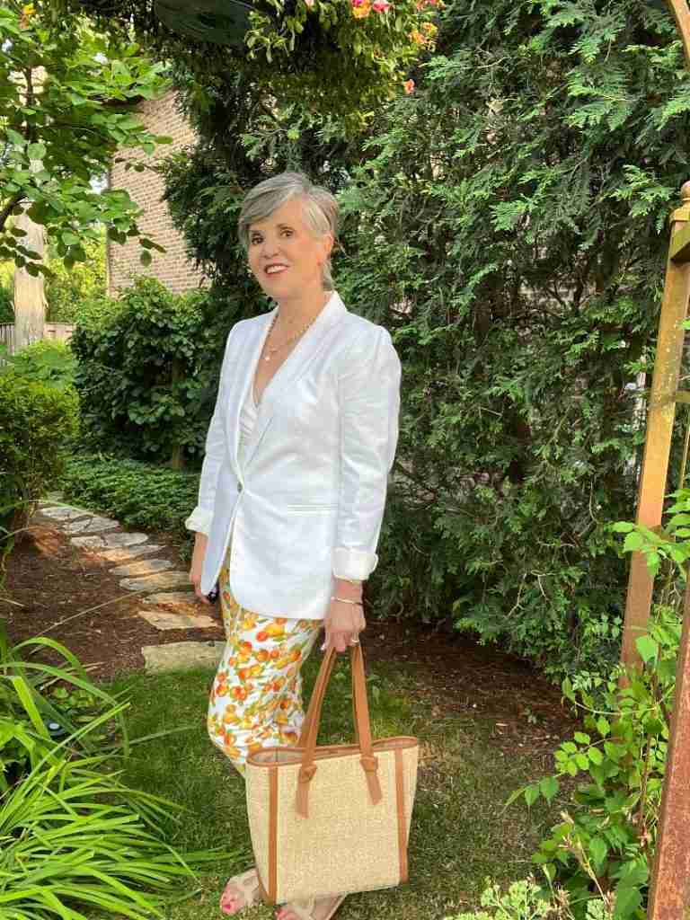 Here is one of the patterned pants outfits where I am headed to work.  I paired a white v-neck top with a white linen blazer and a woven tan tote.
