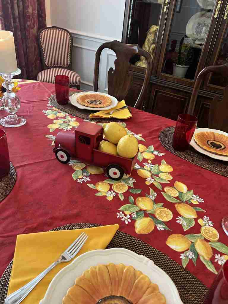 For a really cute centerpiece, I took a red  vintage truck and put real lemons in the back of it.