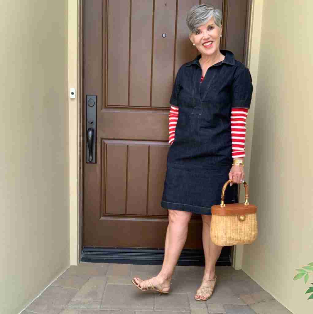 Here is a Ralph Lauren denim dress with a red and white striped Tee underneath.  My sandals are nude and flat.  My bag is a darling J McLaughlin wicker and leather bucker bag.