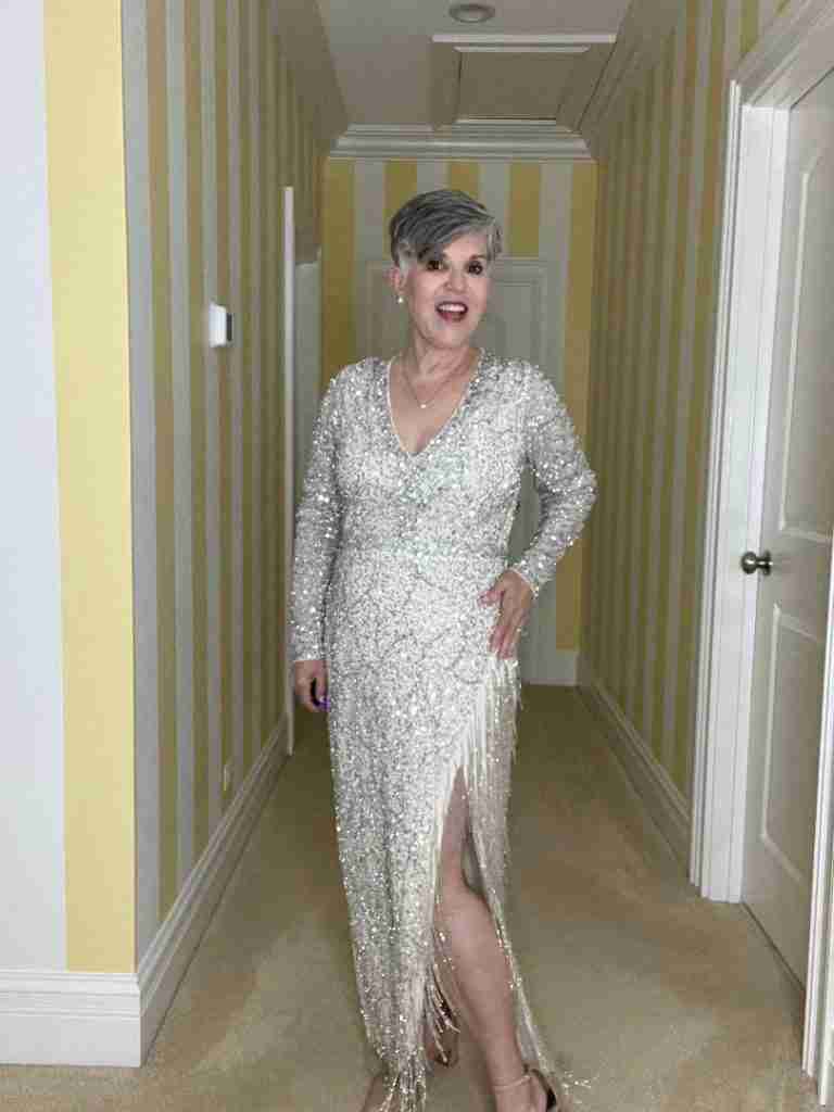 Here I am in a long silver beaded gown with a pretty side slit.  The neckline is a flattering v-neck.