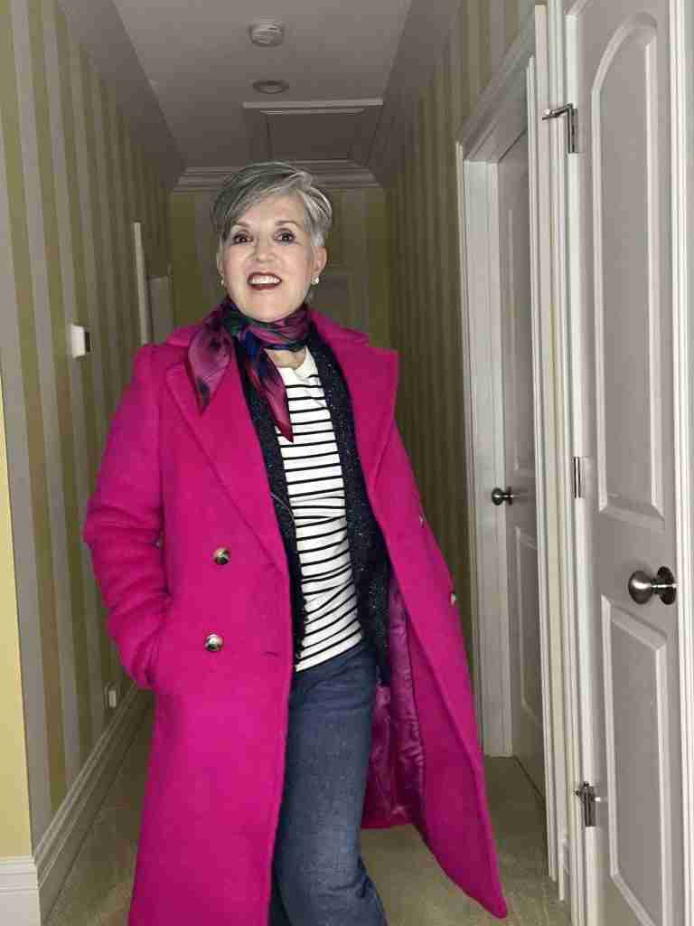 Here I am with the classic fuchsia coat worn over a striped tee and a blue tweed lady jacket.  I added a silk scarf at the neck and my jeans are a stovepipe style in a medium wash.