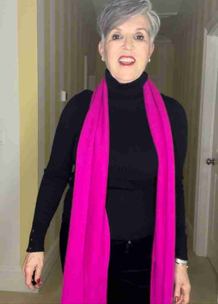 Here I am wearing a fuchsia cashmere scarf over a black ribbed Arlette turtleneck and black velvet jeans.
