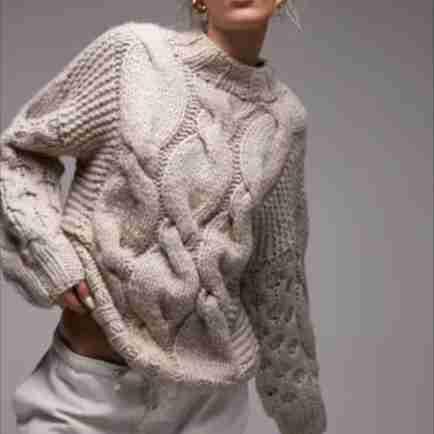 A chunky cable sweater