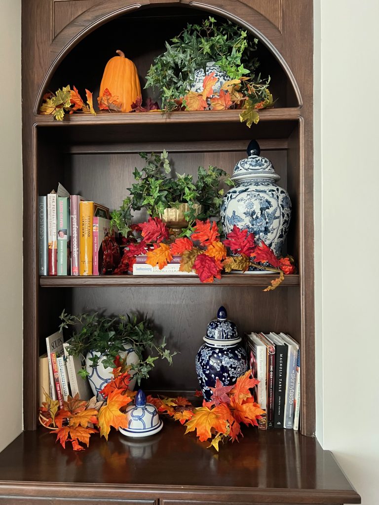 Cozy fall decor as seen on these great room shelves.